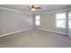 Bright bedroom featuring neutral walls and plush carpeting at 3716 Massey Ridge Ct, Raleigh, NC 27616