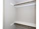 Walk-in closet with wood hanging rods and shelving at 3716 Massey Ridge Ct, Raleigh, NC 27616