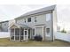 Two-story house with screened porch and grilling area in backyard at 3716 Massey Ridge Ct, Raleigh, NC 27616