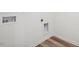 Clean laundry room with laminate flooring and hookups at 222 Chestnut Oak Ln, Lillington, NC 27546