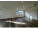 Bright living room with hardwood floors, abundant natural light, creating a bright and welcoming space at 222 Chestnut Oak Ln, Lillington, NC 27546