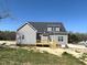 New construction featuring gray siding, a wood deck, and double-hung windows at 1681 S Old Carriage Rd, Rocky Mount, NC 27804