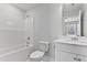 Clean bathroom featuring a shower-tub combo, toilet, and vanity at 2038 Fishamble St, Fuquay Varina, NC 27526