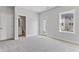 Neutral bedroom featuring an ensuite bathroom and a window overlooking the outside at 2038 Fishamble St, Fuquay Varina, NC 27526