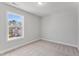 Bright bedroom with carpet, a single window, and neutral paint at 2038 Fishamble St, Fuquay Varina, NC 27526