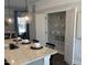 Modern kitchen featuring granite countertops, stylish lighting, and a pantry at 2038 Fishamble St, Fuquay Varina, NC 27526