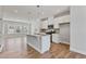 Modern kitchen with white cabinets, stainless steel appliances, and a granite countertop island at 2038 Fishamble St, Fuquay Varina, NC 27526