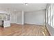 Open-concept living space with wood floors, a kitchen island, and multiple windows at 2038 Fishamble St, Fuquay Varina, NC 27526