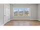 Bright, airy room with three windows and wood-look flooring at 2038 Fishamble St, Fuquay Varina, NC 27526