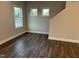 Bedroom features hardwood floors and two large windows at 2042 Fishamble St, Fuquay Varina, NC 27526