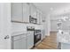 Kitchen with stainless steel appliances, gray cabinets, and white tile backsplash at 2042 Fishamble St # 32, Fuquay Varina, NC 27526