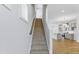 Carpeted staircase leading to the upper level, showcasing the home's modern design with open views at 2042 Fishamble St # 32, Fuquay Varina, NC 27526