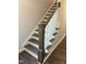 Charming staircase features dark wood treads and white risers at 2042 Fishamble St, Fuquay Varina, NC 27526