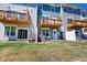 Townhome backyard with green lawn, patios, decks, and white fences at 2337 Bay Minette Sta # 553, Apex, NC 27502
