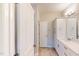 Bright bathroom featuring white cabinetry and tile flooring, complemented by modern fixtures at 2337 Bay Minette Sta # 553, Apex, NC 27502
