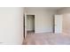 Neutral bedroom with open closet and bathroom door at 2337 Bay Minette Sta # 553, Apex, NC 27502