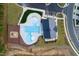 Aerial view of community pool with ' playground, pool house, and parking at 2337 Bay Minette Sta # 553, Apex, NC 27502