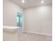 Light-filled hallway featuring neutral carpet and an open doorway to a naturally lit bedroom at 2337 Bay Minette Sta # 553, Apex, NC 27502