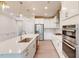 Bright kitchen featuring white cabinets, stainless steel appliances and hardwood floors at 2337 Bay Minette Sta # 553, Apex, NC 27502