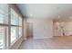 Bright living room showcasing large windows and open-concept design with hardwood floors at 2337 Bay Minette Sta # 553, Apex, NC 27502
