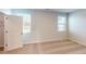 Bright bedroom with neutral carpeting and two windows at 2370 Bay Minette Sta # 697, Apex, NC 27502