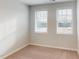 Spacious bedroom with carpet and two windows at 2370 Bay Minette Sta # 697, Apex, NC 27502