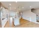 Open concept kitchen with island and hardwood floors at 2370 Bay Minette Sta # 697, Apex, NC 27502