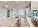 Bright kitchen with island, stainless steel appliances, and water view at 2370 Bay Minette Sta # 697, Apex, NC 27502