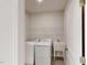 Bright laundry room, washer, dryer, and utility sink at 2370 Bay Minette Sta # 697, Apex, NC 27502