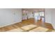 Open concept living room and kitchen with hardwood floors at 2370 Bay Minette Sta # 697, Apex, NC 27502
