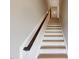 Interior stairs with wooden treads and dark wood handrail at 2370 Bay Minette Sta # 697, Apex, NC 27502