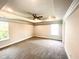 Large main bedroom featuring a tray ceiling with fan at 538 Middleton Ct, Sanford, NC 27330