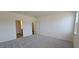 Spacious primary bedroom featuring plush carpeting and neutral decor at 566 John Stark Dr, Fuquay Varina, NC 27526