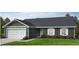 Charming single-story home with a gray exterior, white trim, and attached garage at 566 John Stark Dr, Fuquay Varina, NC 27526
