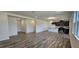 Open concept living room and kitchen featuring hardwood floors and recessed lighting at 566 John Stark Dr, Fuquay Varina, NC 27526