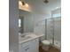 Modern bathroom featuring a glass-enclosed shower and quartz countertops at 57 Bering Cir, Angier, NC 27501