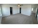 Spacious bedroom with neutral carpet, ceiling fan, and ensuite bathroom and closet at 57 Bering Cir, Angier, NC 27501