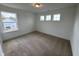 Bedroom with neutral carpet, large window offering plenty of natural light at 57 Bering Cir, Angier, NC 27501