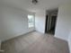 Bedroom featuring neutral carpet and trim, and window offering plenty of natural light at 57 Bering Cir, Angier, NC 27501