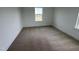 Bedroom featuring neutral carpet, natural light, and white trim at 57 Bering Cir, Angier, NC 27501