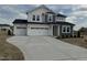Charming two-story home boasts three-car garage and inviting curb appeal at 57 Bering Cir, Angier, NC 27501
