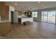 Spacious kitchen with wooden cabinets and a central island, open to the living space at 57 Bering Cir, Angier, NC 27501