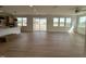 Open concept living area with wood floors, windows, and seamless access to the kitchen at 57 Bering Cir, Angier, NC 27501
