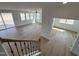Bright living room featuring light wood floors, lots of windows, and open floorplan at 57 Bering Cir, Angier, NC 27501
