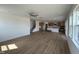Expansive open-concept living area featuring wood floors and kitchen at 57 Bering Cir, Angier, NC 27501
