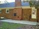 The backyard features a brick chimney, patio and grassy area perfect for entertaining at 301 Briarcliff Dr, Dunn, NC 28334
