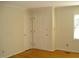 Bright bedroom with hardwood floors, two doors and window with natural light at 301 Briarcliff Dr, Dunn, NC 28334