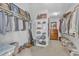 Organized walk-in closet providing ample storage with shelving and hanging space at 5335 Cypress Ln, Raleigh, NC 27609