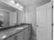 Bathroom featuring vanity with granite counters and oversized mirror at 5554 Lake Vista Ct, Rocky Mount, NC 27803