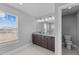 This bathroom offers a double vanity, tile floors, plenty of light and a toilet at 5554 Lake Vista Ct, Rocky Mount, NC 27803